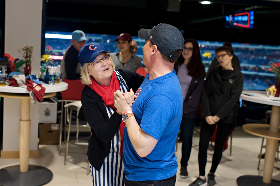 A groom and his mother dance at the Phillies game reception to Take me out to the ball game.